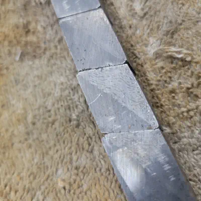 Raw billet of pattern-welded steel